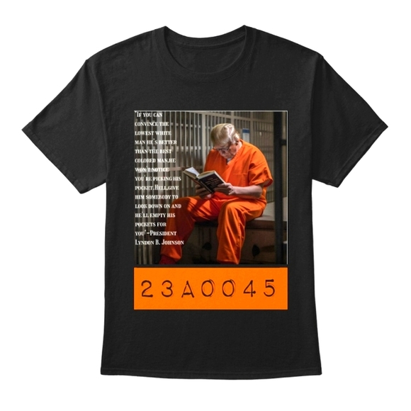 Trump in a prison cell reading - Picture 1 of 1